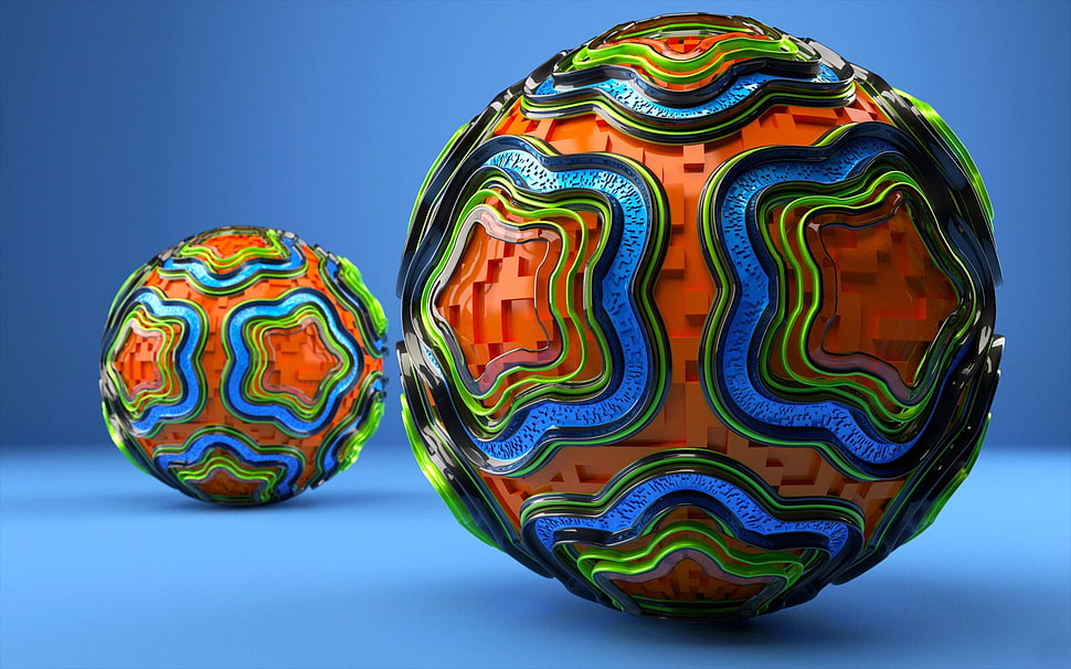two round orange and black balls HD wallpaper