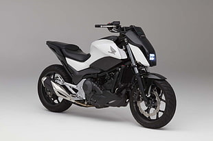 white and black Honda motorcycle