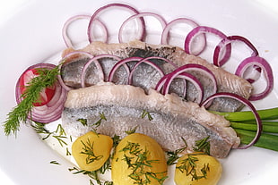 fish dish with onions and potatoes