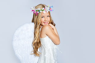 girl wearing white angel costume