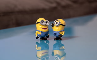 two Despicable Me action figure standing in a blue floor