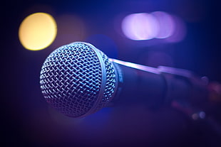 closed up photo of gray microphone with bokeh lights
