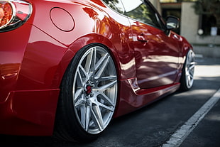 closeup photo of red coupe