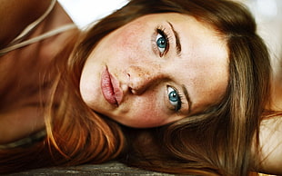 brown haired woman with blue eyes