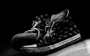 grayscale photo of high-top sneakers