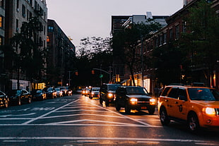 photo of cars on street during night time
