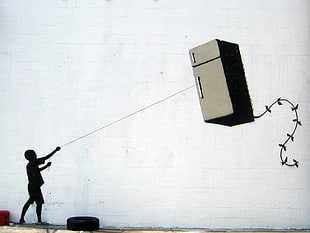 boy holding top-mount refrigerator kite