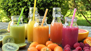 five assorted clear glass jars filled with juices HD wallpaper