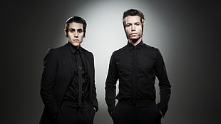 two men in black suit jacket