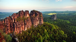 photo of rock formation near trees