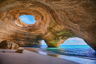 brown cave on shore, nature, sea, beach, rock
