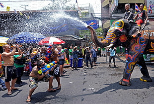 group of people celebrating festival on street
