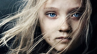 close up photography of girl with blond hair and blue eyes
