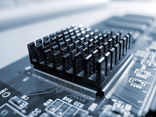 black electronic component attached on black circuit board