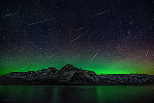 green and black wooden table, stars, aurora  borealis, mountains, water