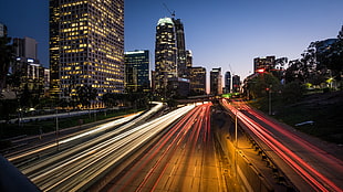 time-lapse photo of high-rise buildings and highway road, highway 110, los angeles