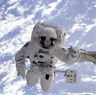 photo of astronaut floating on space