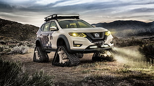 white Nissan Rogue with continuous tracks