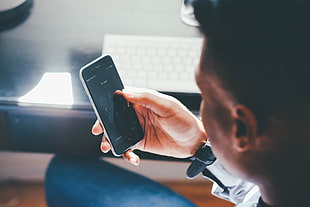 person holding silver android smartphone
