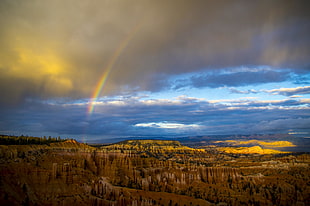 rainbow over the Bryce canyon under blue and cloudy sky HD wallpaper
