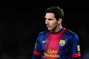 Lionel Messi wearing blue and red jersey