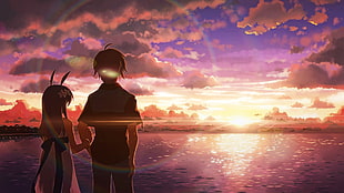 girl and boy stands near sea during golden hours