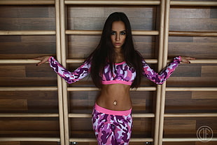 woman in pink and purple camouflage long-sleeved crop top