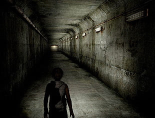 person in gray tunnel