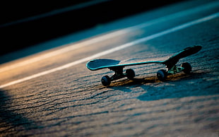 black skateboard on street