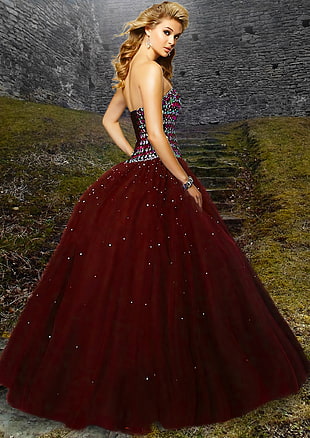 woman in red silver studded backless long gown