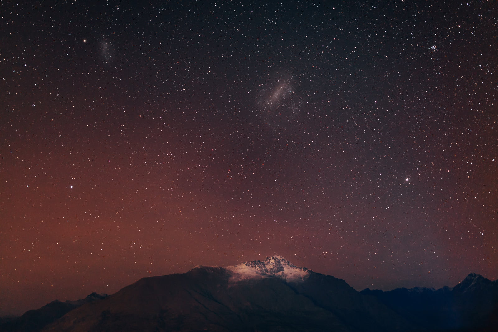 aerial view of mountain under black sky with stars, queenstown, otago
