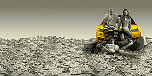 selective color photography of yellow car with four people sitting surrounded with banknotes