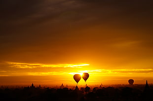 silhouette photo of hot air balloons during sunset, bagan