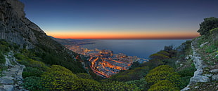 green grass field mountain, city, sea, sunset, Monaco