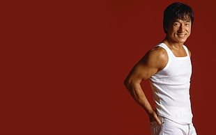 Jackie Chain wearing white scoop-neck tank-top with red background HD wallpaper