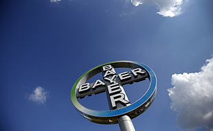 Bayer Logo signage under clear blue partly cloudy sky during aytime HD wallpaper