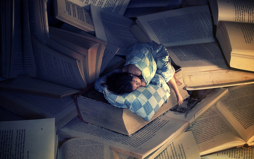 woman sleeping with giant books HD wallpaper