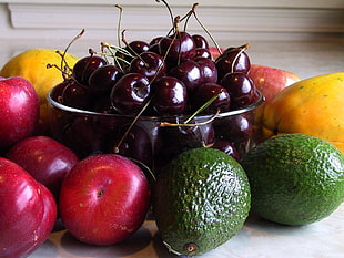assorted fruits on top of wooden surface during daytime