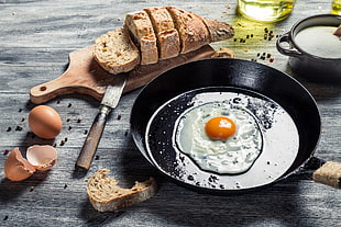 black frying pan, eggs, food, bread