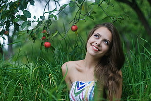 woman talking photo near apple tree