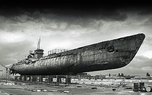 grayscale photo of submarine on dock, photography