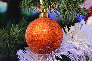 shallow focus photography of orange bauble
