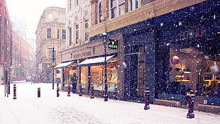 man walking near shopfront during winter HD wallpaper