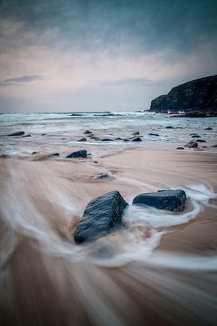 beach and stone timelapse photography HD wallpaper