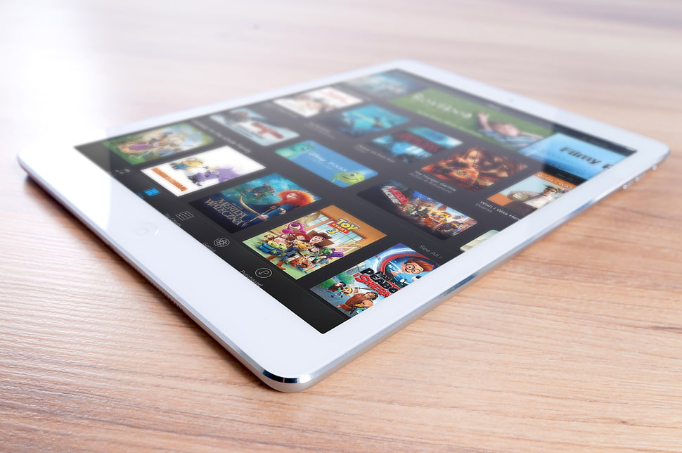 white tablet computer on brown flat surface HD wallpaper