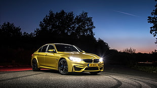 yellow BMW sedan HD wallpaper
