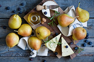 pear fruits on brown wooden slab