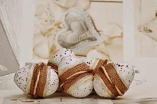 five white egg shape table decor on white surface