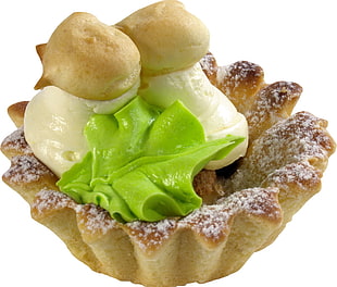 pastry bread topped with white and green whipped cream