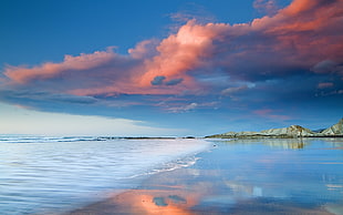 sea under orange and blue skies HD wallpaper